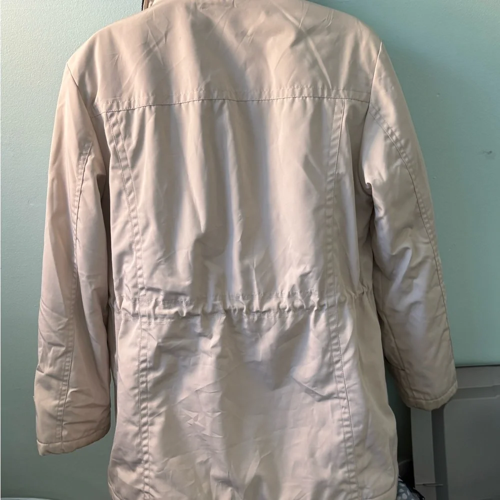 The London Fog women's trench coat in beige with a corduroy brown collar is a cl